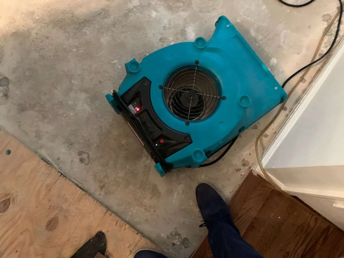 Air mover drying subfloor during Leak Detection & Repair in Rincon Valley
